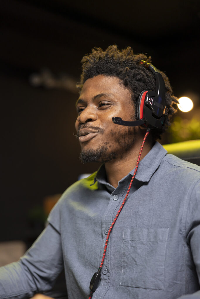 Cheerful gamer smiling after winning game on gaming PC